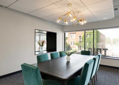 Photo of a board table in a bright conference room
