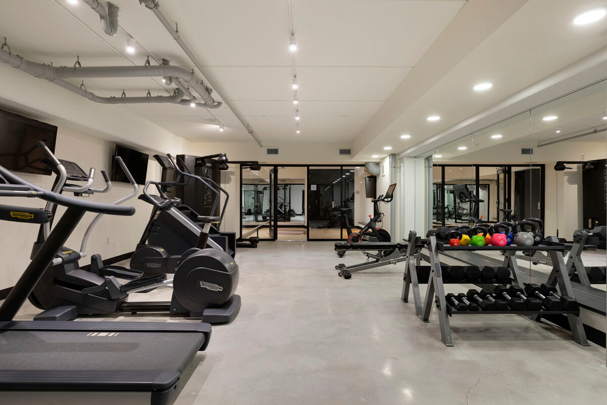 Fitness center with various workout machines and weights